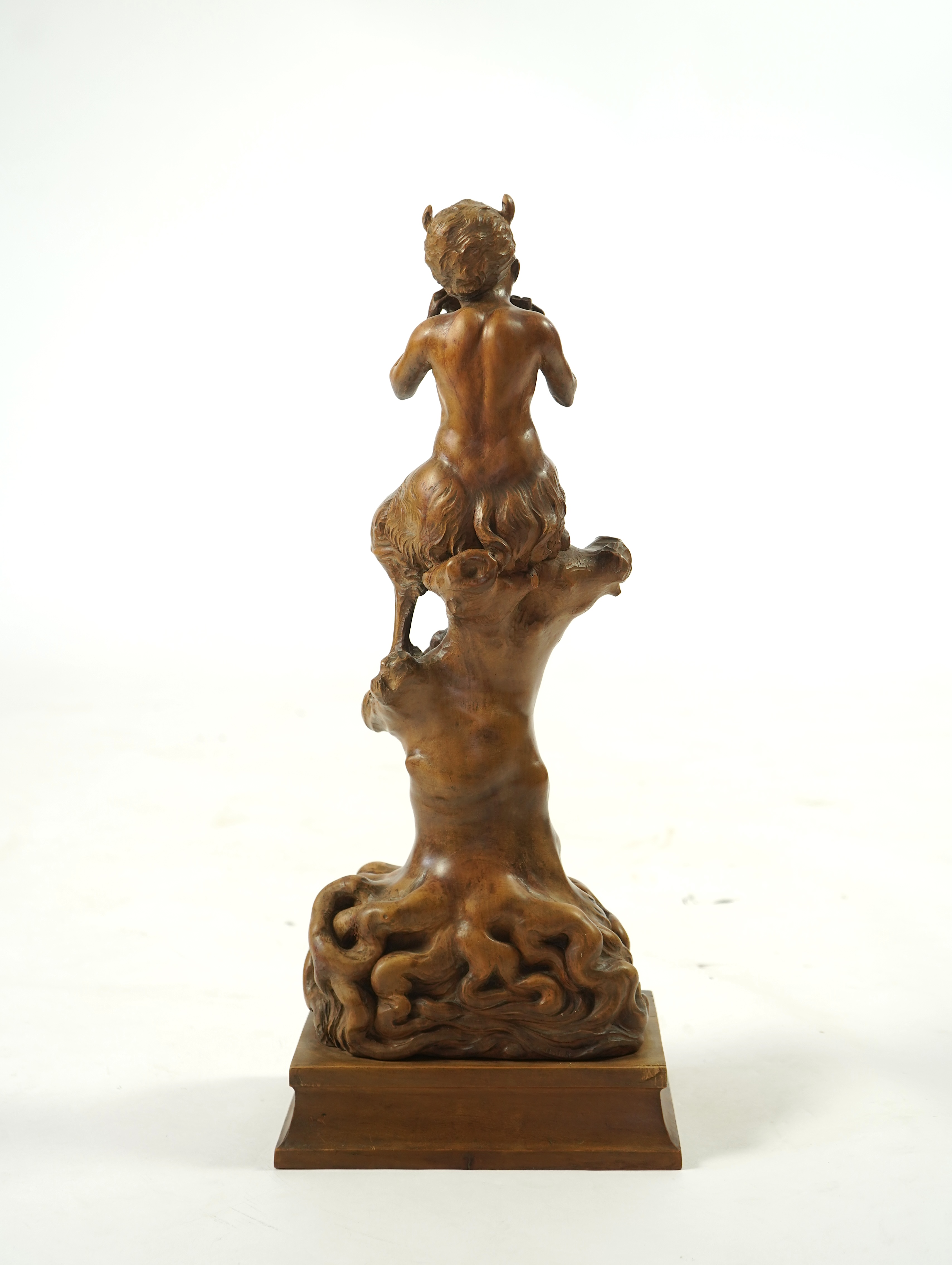 A late 19th century French carved walnut figure of Pan